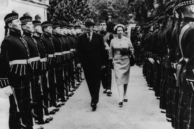 President Eisenhower and HM Queen Elizabeth II inspecting a Guard of Honor at the gates of Balmoral, Scotland, August 28th 1959. (Photo by Keystone/Hulton Archive/Getty Images)