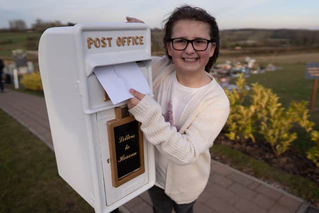 Matilda Handy, 9, and mum, Leanne Handy 45 with their letter box to heaven, in Gedling Crematorium, which allows grieving members of the public to write a letter to their loved ones who have passed away. (Picture credit by SWNS)