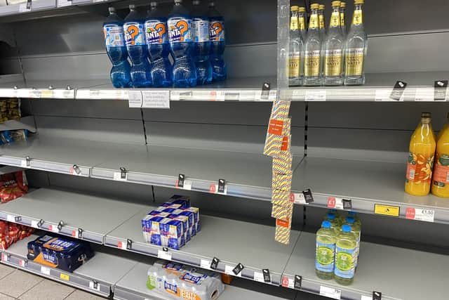 Photo taken with permission from the Twitter feed of @HapG86 of empty shelves in a Co-op (PA)