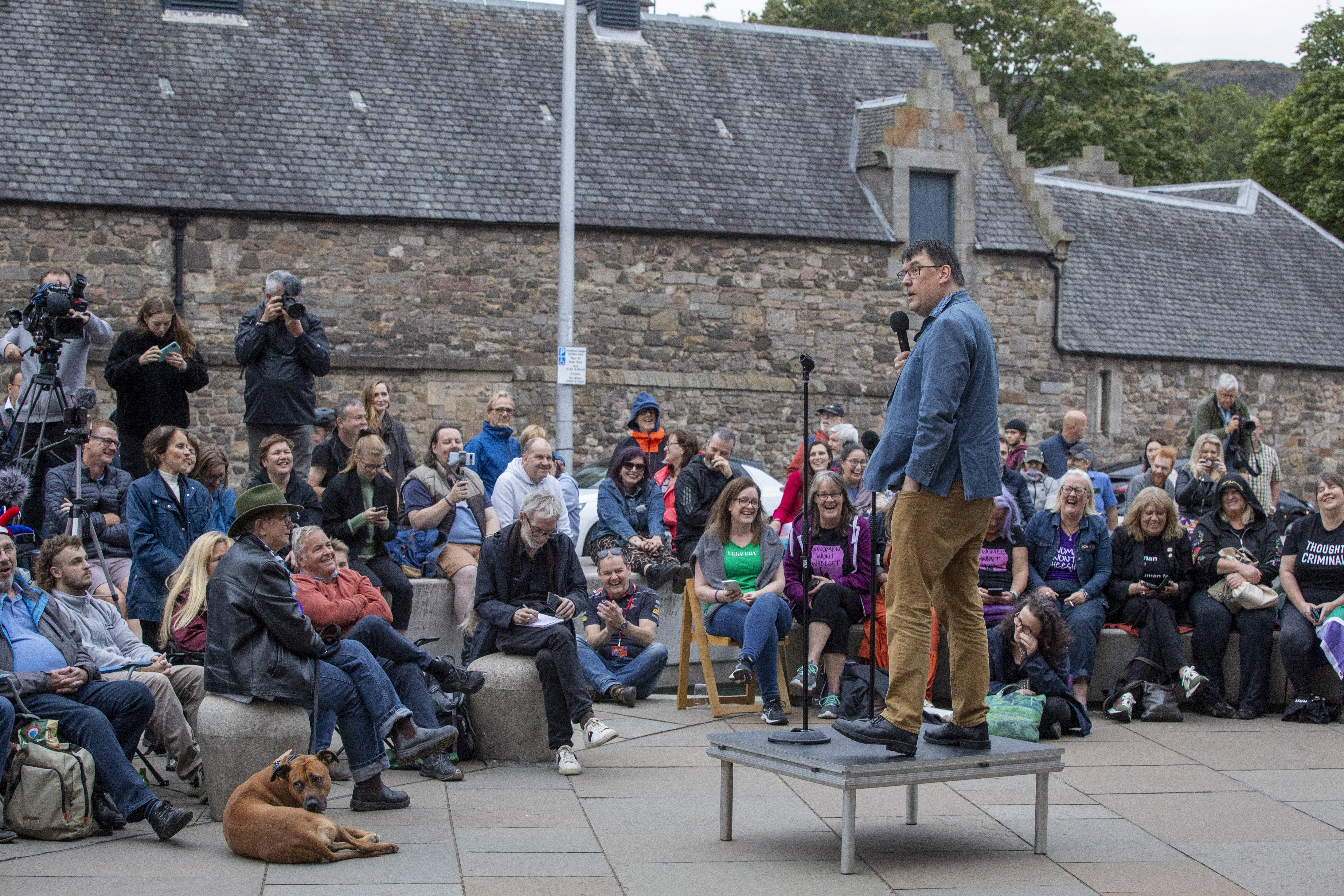 Graham Linehan performs outside Scottish Parliament