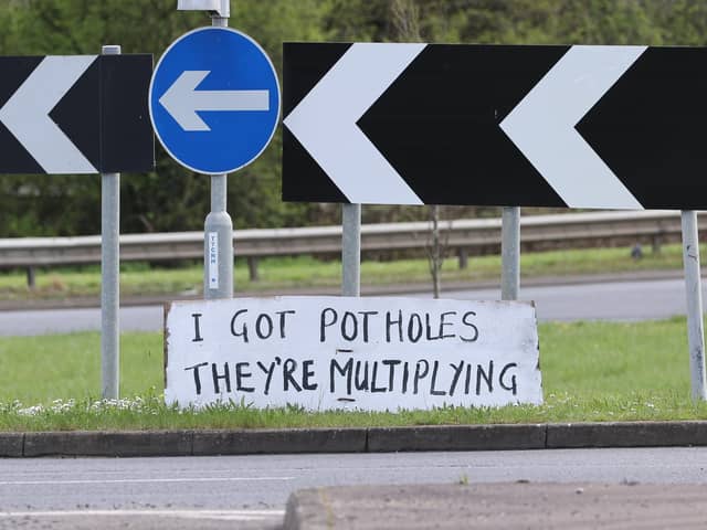 Protest sign at a roundabout on Eastern Way in Daventry - A series of protest signs highlighting the Daventry pothole problem by the mystery campaigner.  
