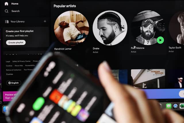 In this photo illustration, the Spotify music app is seen on a phone. Photo by Michael M. Santiago/Getty Images