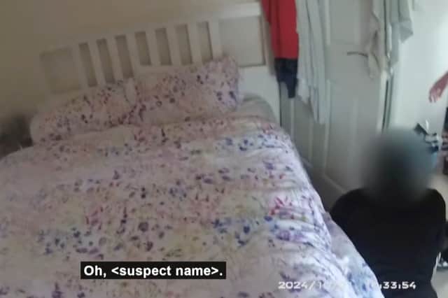 Suspected burglar found underneath bed - hiding from police.