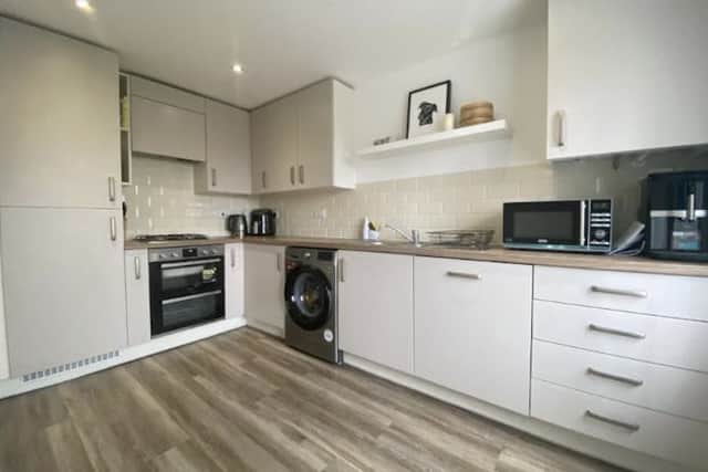 The modern kitchen has fitted appliances