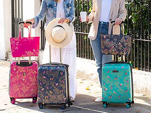 These new colourful pink, blue and green suitcases from Sara Miller London are standout luggage - and they fit within Ryanair size requirements.