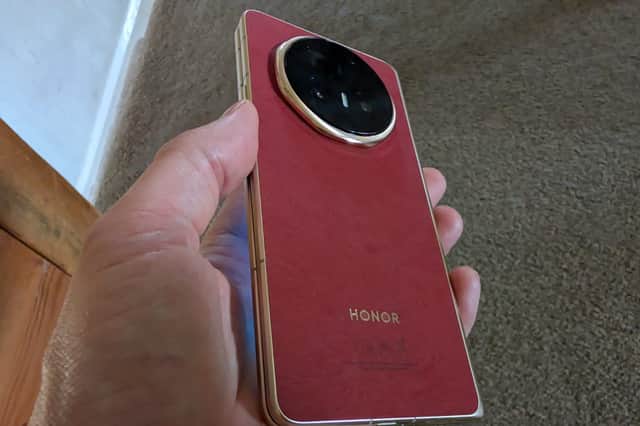 The textured red case feels like something between suede and leather. It won't suit everyone, but it's very nice