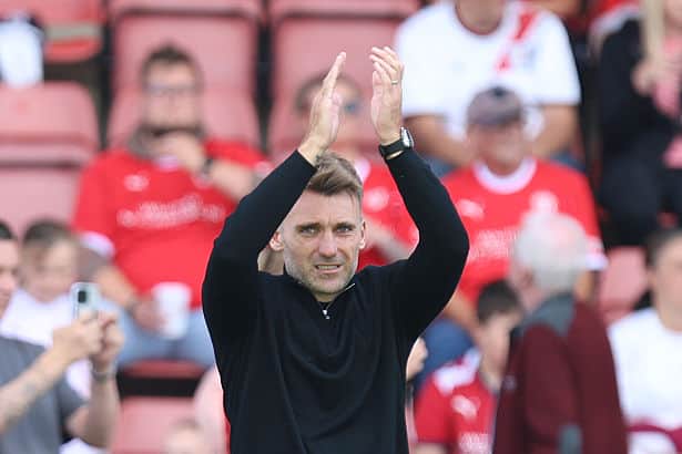 Chris Hogg applauds the away fans at Crewe