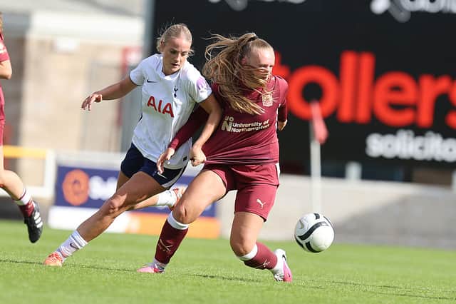 Chloe Finn of Northampton Town controls the ball under pressure from Eloise Summers Mee of Tottenham Hotspur