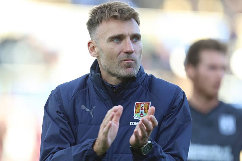 Chris Hogg applauds the away fans at York 