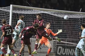 Bobby Faulkner's header flies past Zach Jeacock and nestles into the corner 