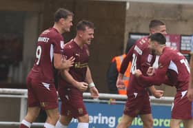 Sam Hoskins celebrates his 106th Cobblers goal 