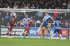 Matty Warhurst heads Cobblers into the lead against Colchester