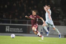 Sam Hoskins skips away from Ryan Watson during last week’s game against Tranmere