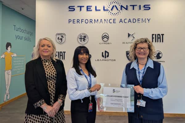 Rachel Roberts, The Bedford College Group presenting the Employer Partnership Scheme plaque to The Stellantis Performance Academy
