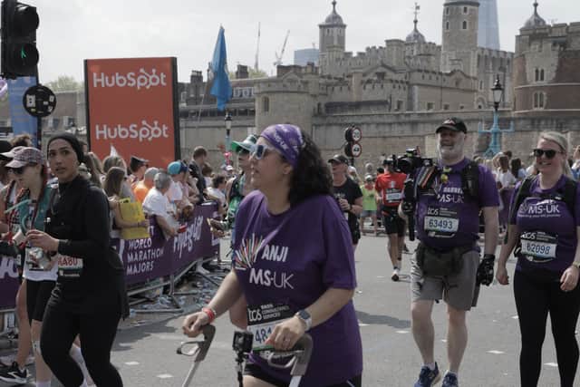Anjali, Darren and Nicky passing The Tower of London during the TCS London Marathon 2025