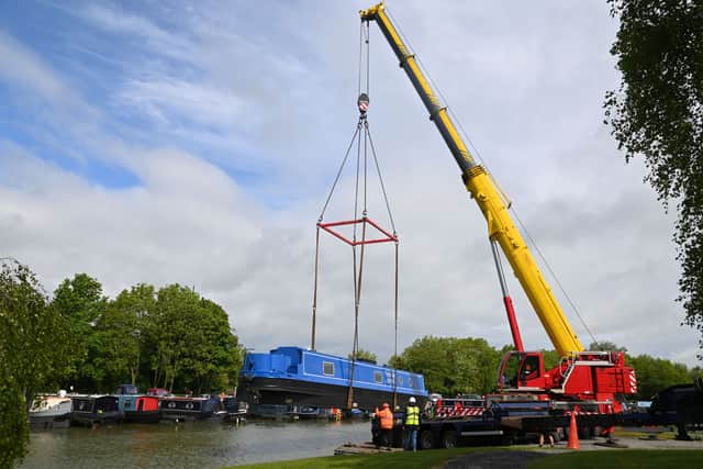 Narrowboat craned into Crick Marina for Boat Show, to be held over the bank holiday weekend, 23-25 May