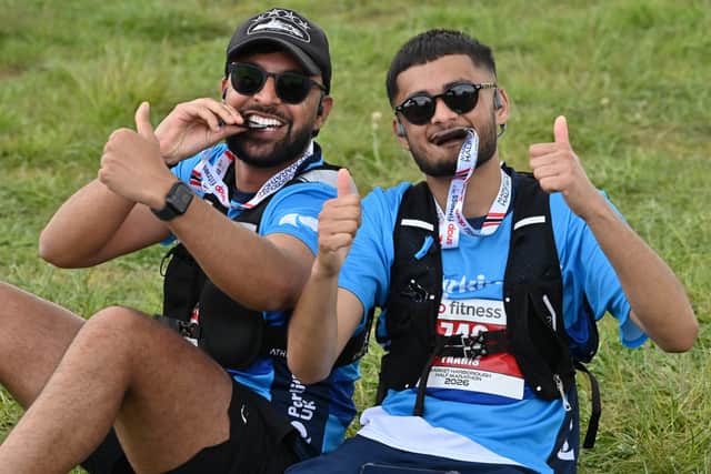 Happy runners relaxing after finishing the race