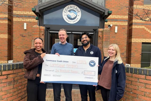 Matt Goulding and members of the Commsave team with the prize cheque