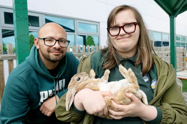 A student from Daventry Hill School is pictured with Lawrie Keegan from Amazon and Ray the rabbit.