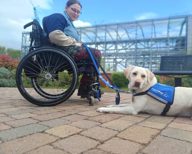 Megan Green with newly-qualified support dog Lyra 