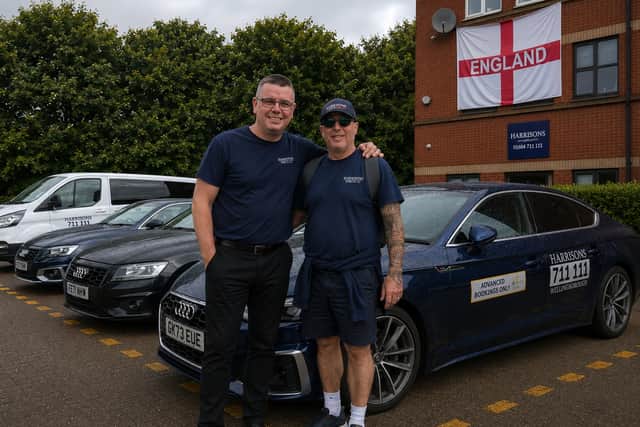 Harrison's Taxis owners Ryan Church and Eddie Portelli pictured with part of the company's fleet ahead of the launch of their World Cup charity fundraising campaign.
