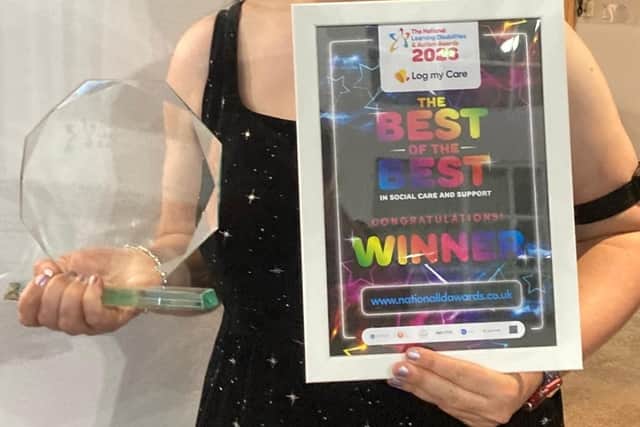 Vicky pictured with her award and certificate.