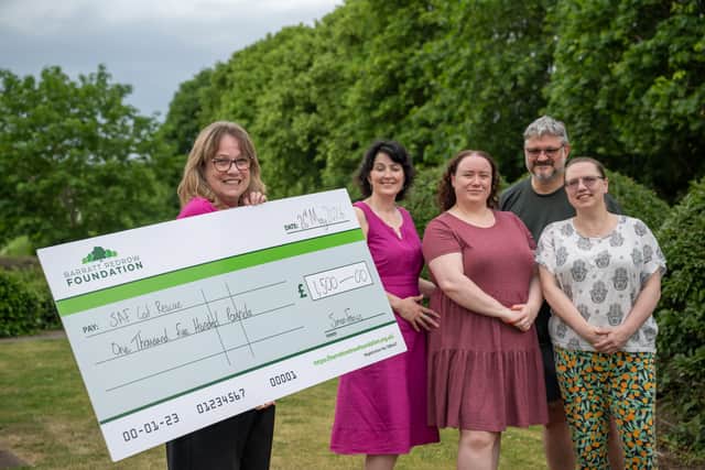 BN - SGB-599 - Staff from SAF Cat Rescue with their cheque from Barratt Homes