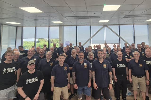Hero's welcome: Gerry with colleagues at NMVC