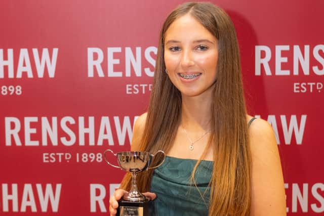 Elisabeth Crowley holds Renshaw Cup Trophy
