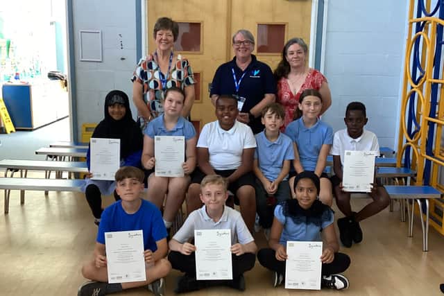 St James CE Primary School pupils proudly celebrate achieving their BSL Level 1 certificates with Jane Birch, Tanya Wing and Miss Felton