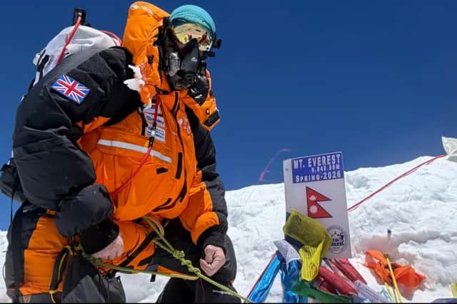 Michael Woods reaches the summit of Mount Everest in Spring 2026