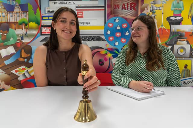 Liberty PR account manager Martha Casey (left) and account executive Maisie Huseyin ring the Liberty Bell to mark the launch of Liberty PR On Demand, a new fixed-price offering with no long-term contracts for SME businesses and in-house teams.