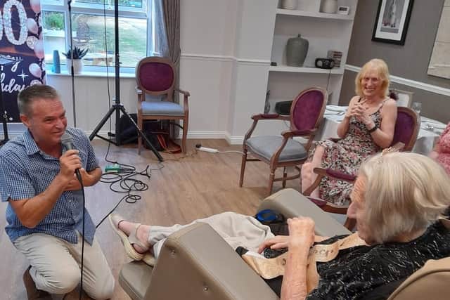 Vera enjoying having Happy Birthday being sang to her by vocalist Dean Jones