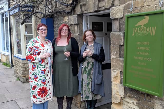 (L-R ) Penny, Rhiannon and Tarot, the owners of Jackdaw Gallery, standing outside the front door on opening day