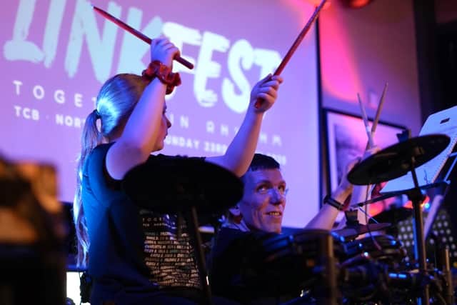 Drum student counts off the group on stage at LinkFest 2025. Photo credit Bethany Brady.