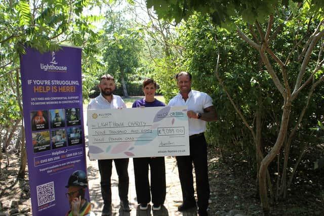 Cheque handover with the Lighthouse Charity