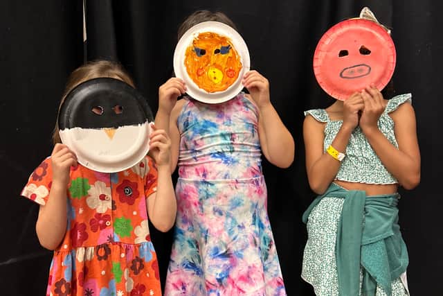 Children attending the workshop created their own masks to help them get into character.
