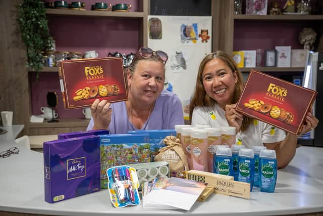 BN - SGB-12368 - Catherine and Jaena from Glenvale Park Care Home with some of the items from the donation