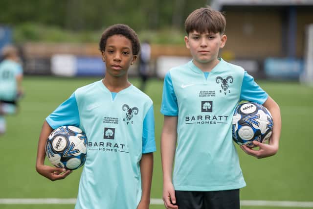 BN - SGB-31 - Two players from SYL Whites U13s in their sponsored kits