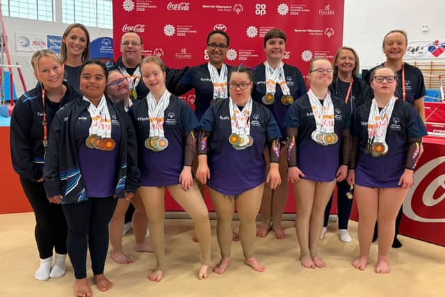 Coaches Cora, Evie, Anne & Lorraine celebrate with their gymnasts Evie, Ellie, Ffion, Ruth, Lola, Tayla (Front line) Lee, Emily, Morgan (Back line)
