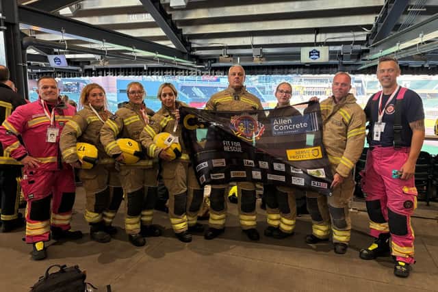 The team of eight firefighters pictured ahead of the stair climb.