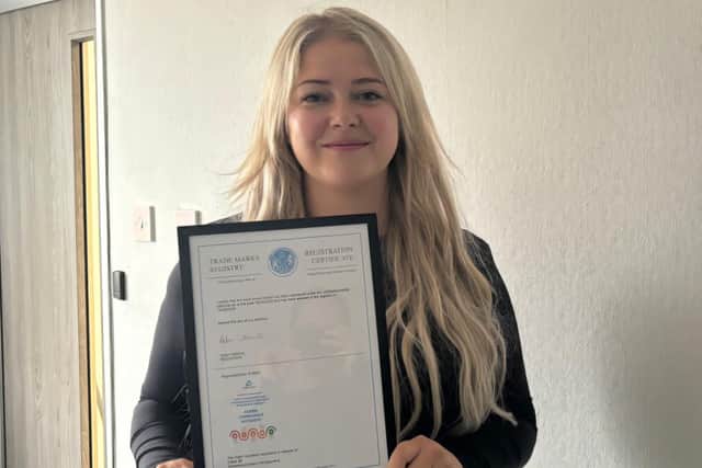 Operations Director Zeynep Guzelkasap with the trademark certificate