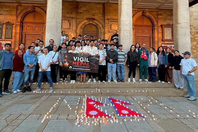 Nepalese community members gather for a candlelight vigil in Northampton in memory of those affected by the devastating floods in Nepal