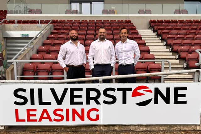 Silverstone Leasing’s Scott Norville (right) and Ryan Bishop (centre) with Northampton Town Football Club’s James Corrigan.