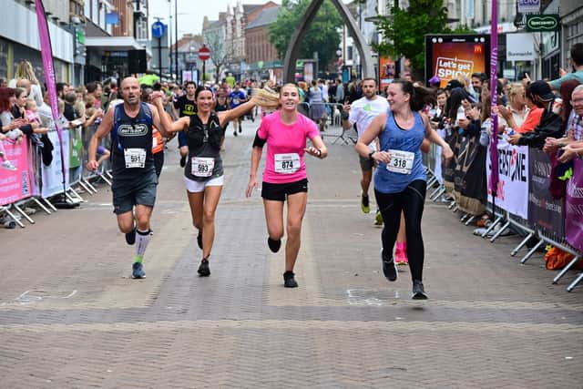 Runners about to cross the finish line of the Amazing Northampton Run 