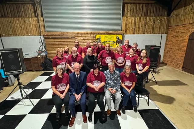 Chairman Neil Byrd, second front right, with the committee and volunteers
