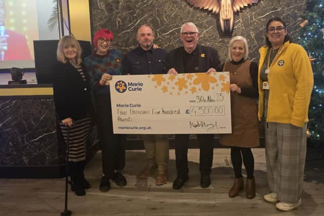 “Motown” Mick Murphy presents a £4,500 cheque to Marie Curie at The Black Diamond
