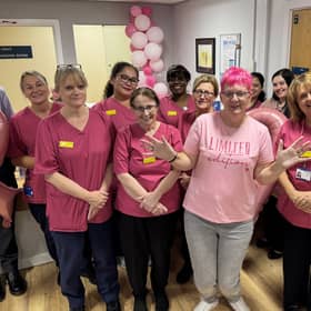 Tracey Fox with the breast screening team in pink scrubs at the Forrest Centre, Northampton General Hospital, during Breast Cancer Awareness Month (October)
