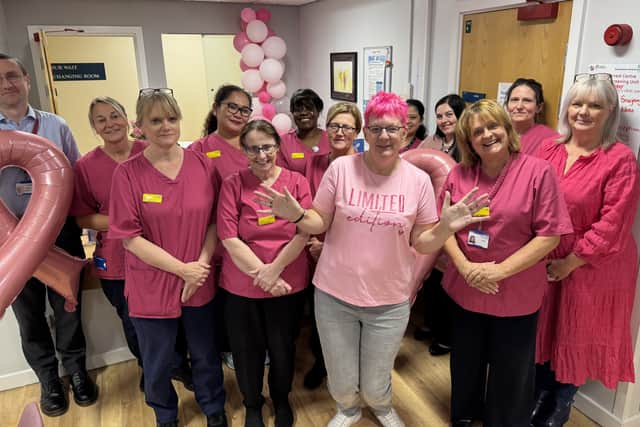 Tracey Fox with the breast screening team in pink scrubs at the Forrest Centre, Northampton General Hospital, during Breast Cancer Awareness Month (October)