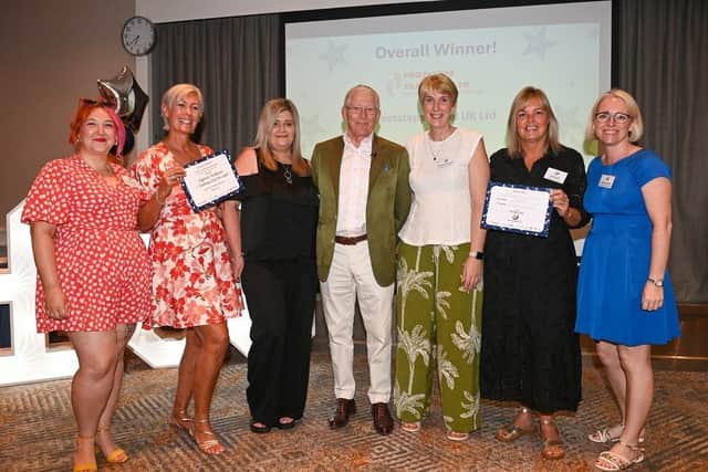 Footsteps Travel, who were the highest fundraising team for the 2026 Challenge with Emily Griffiths from the Lewis Foundation (far left), Nick Hewer (centre) and Andrea Humphrey (far right).